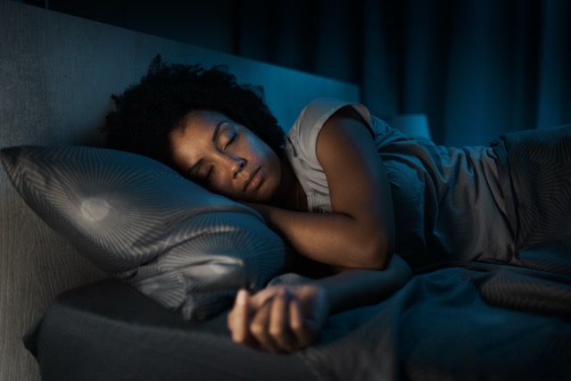 African american woman sleeping in her bed